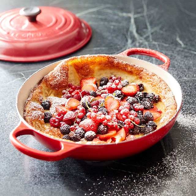 puffed pancake with blueberries and powdered sugar