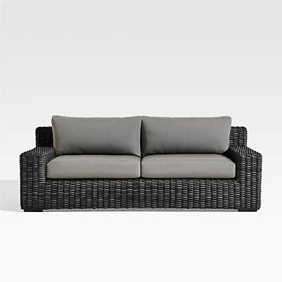 https://cb.scene7.com/is/image/Crate/AbacoSofaCharWGrphCshSOSSS23/$web_pdp_main_carousel_low$/230130120758/abaco-resin-wicker-charcoal-grey-outdoor-sofa-with-graphite-sunbrella-cushion.jpg