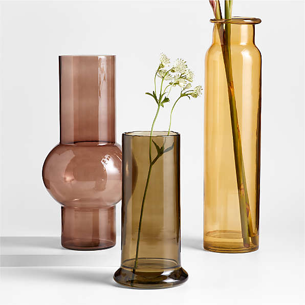 https://cb.scene7.com/is/image/Crate/AmberGreenBrownVasesFSSS24/$web_plp_card_mobile_hires$/230907155702/amber-glass-vases.jpg