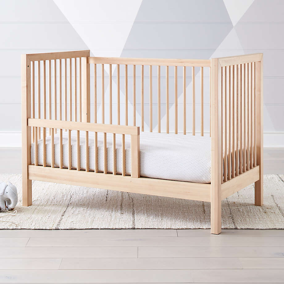 light wood crib and dresser