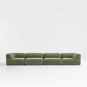 Beige 3 seater sectional couch with green and gray accent pillows