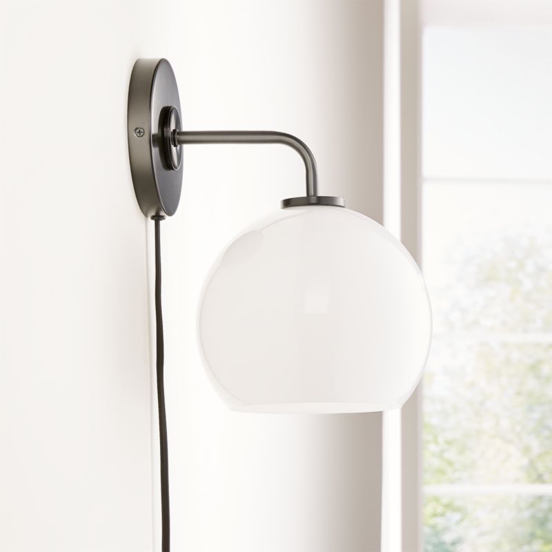 Arren Black Plug In Wall Sconce Light with Milk Round Shade