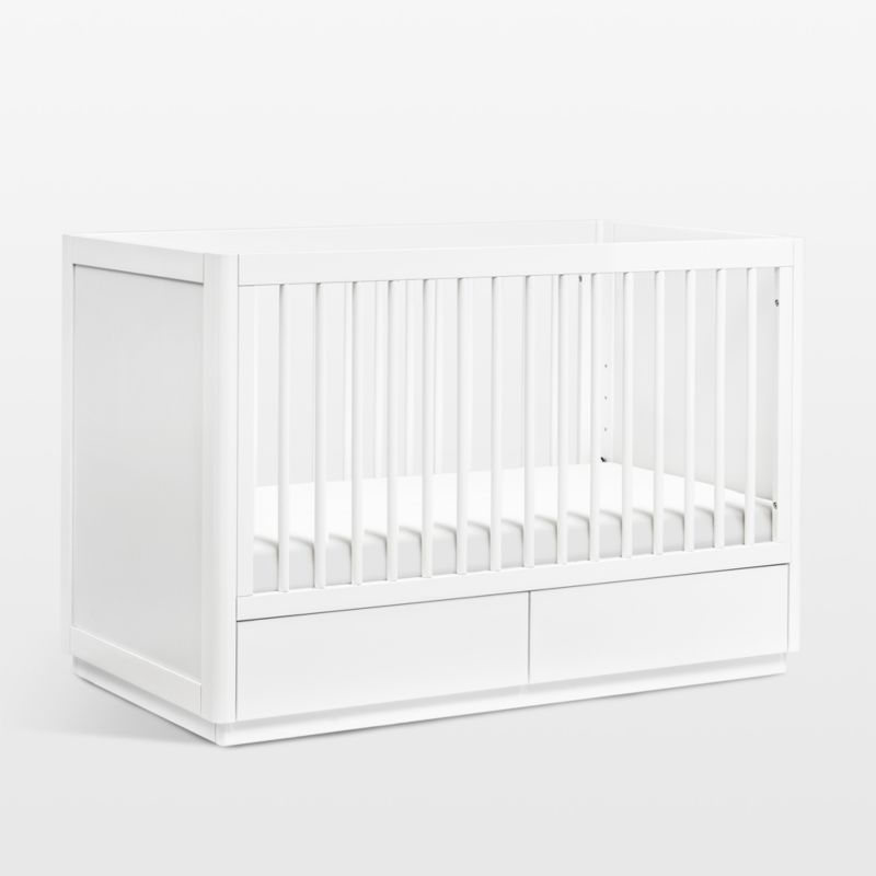 White cot with outlet storage