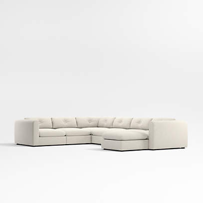 https://cb.scene7.com/is/image/Crate/Bucktown7LCTrALCCrOtt3QSSF23_3D/$web_pdp_main_carousel_low$/230502124529/bucktown-modular-7-piece-sectional-sofa-with-ottoman.jpg