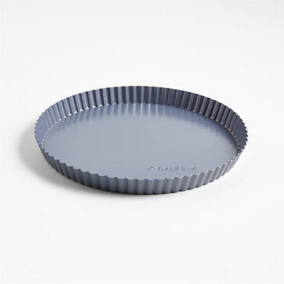 https://cb.scene7.com/is/image/Crate/CBBakeware10inTartPanBLSSF23/$web_pdp_main_carousel_low$/230510125004/crate-and-barrel-10-slate-blue-tart-pan-with-removable-bottom.jpg