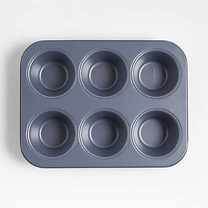 https://cb.scene7.com/is/image/Crate/CBBakeware6cMuffinPanBLSSF23/$web_pdp_main_carousel_low$/230510125006/crate-and-barrel-slate-blue-6-cup-muffin-pan.jpg