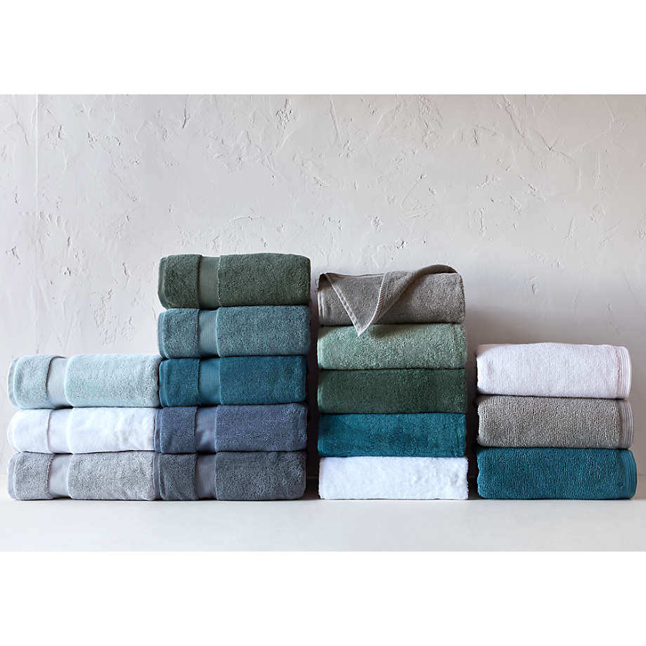 Bathroom inspiration. Green bathroom shower tile with wooden towel rack / drying  rack from Target with Turkish towels from Homegoods. #greenshowert…