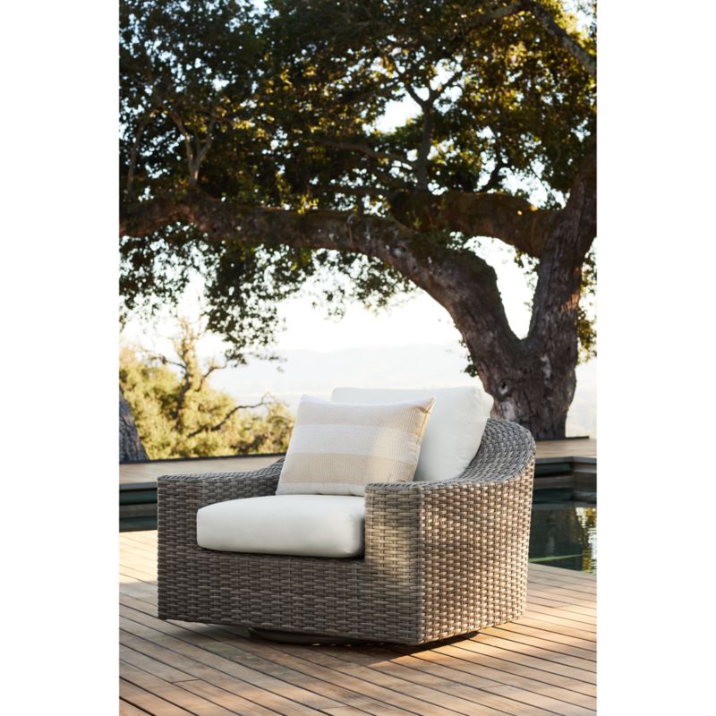 Abaco Taupe Wicker Outdoor Swivel Lounge Chair with White Sand Sunbrella ® Cushions