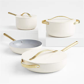 https://cb.scene7.com/is/image/Crate/CarawayHmNSCrCkw7pCrmGHSSS22/$web_pdp_carousel_low$/220214123245/caraway-home-cream-7-piece-ceramic-non-stick-cookware-set-with-gold-hardware.jpg