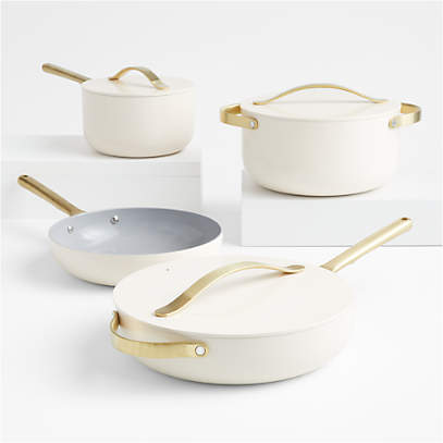 https://cb.scene7.com/is/image/Crate/CarawayHmNSCrCkw7pCrmGHSSS22/$web_pdp_main_carousel_low$/220214123245/caraway-home-cream-7-piece-ceramic-non-stick-cookware-set-with-gold-hardware.jpg