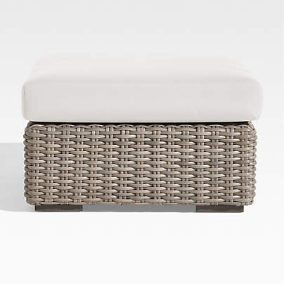 Abaco Resin Wicker Outdoor Ottoman with White Sand Sunbrella ® Cushion