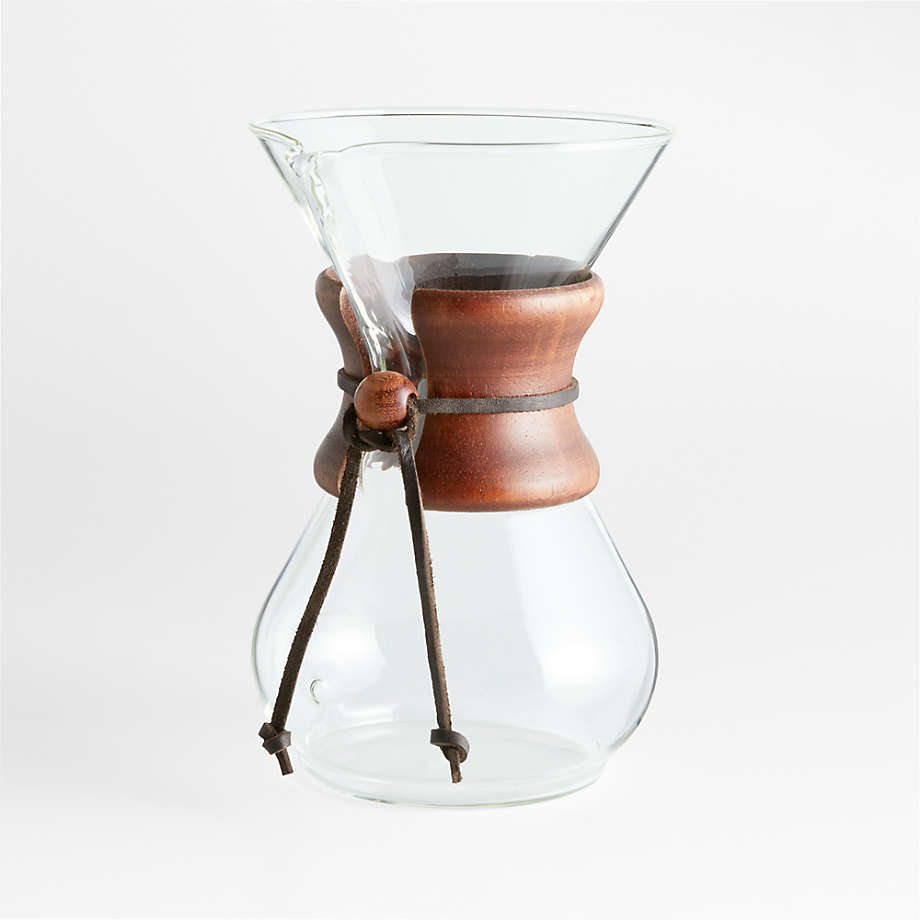 https://cb.scene7.com/is/image/Crate/Chemex6cCffmkrWlntCllrSSF22/$web_pdp_main_carousel_med$/220816131323/chemex-6-cup-glass-pour-over-coffee-maker-with-dark-brown-collar.jpg