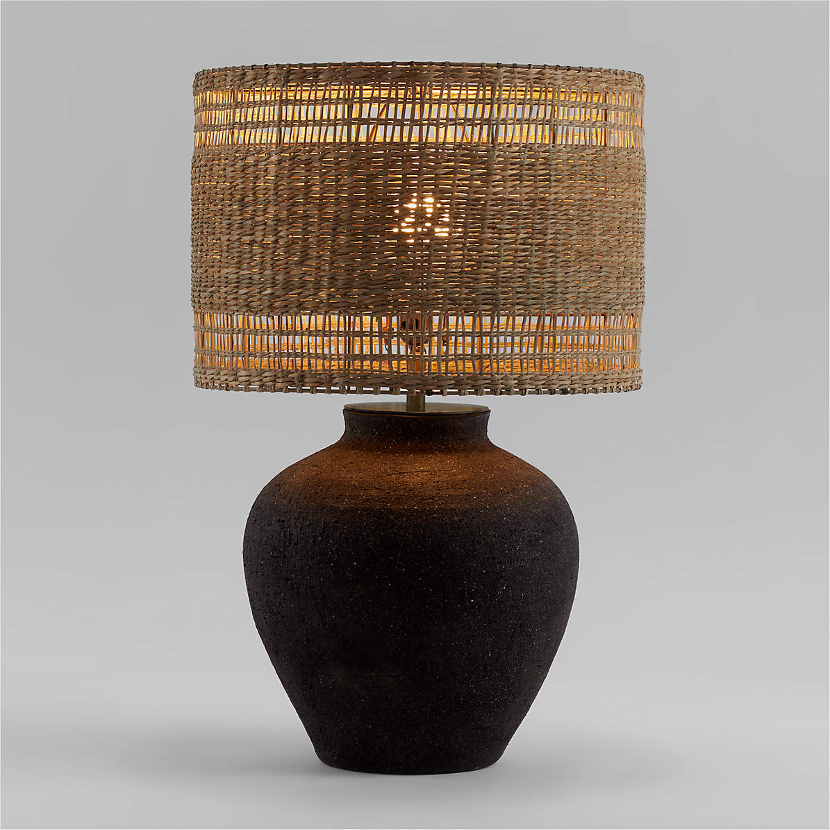 https://cb.scene7.com/is/image/Crate/CorfuGryTblLmpWvnNatShdROS22/$web_pdp_main_carousel_zoom_med$/220915151347/corfu-black-table-lamp-with-woven-natural-shade.jpg