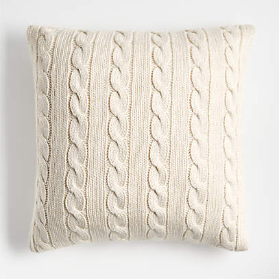 https://cb.scene7.com/is/image/Crate/CozyCableKntAlbBg23inPlwSHF23/$web_pdp_main_carousel_low$/230914131248/alabaster-ivory-cozy-cable-knit-23x23-throw-pillow.jpg