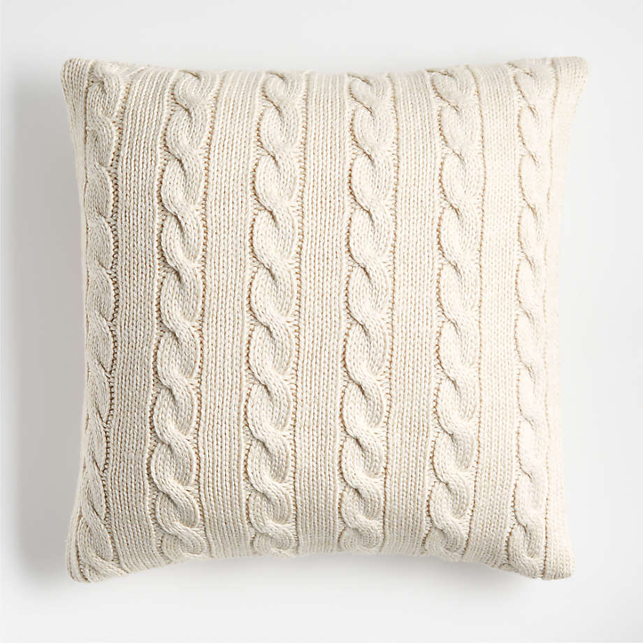 https://cb.scene7.com/is/image/Crate/CozyCableKntAlbBg23inPlwSHF23/$web_pdp_main_carousel_med$/230914131248/alabaster-ivory-cozy-cable-knit-23x23-throw-pillow.jpg