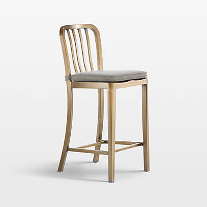 https://cb.scene7.com/is/image/Crate/DeltaBrassCounterStool24inAVGreySSF22/$web_pdp_main_carousel_low$/220824140518/delta-brass-counter-stool-with-felt-grey-cushion.jpg