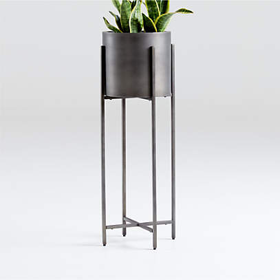 https://cb.scene7.com/is/image/Crate/DundeePlanterWTallStndZncSSF20/$web_pdp_main_carousel_low$/200626170357/dundee-bronze-floor-planter-with-tall-stand.jpg