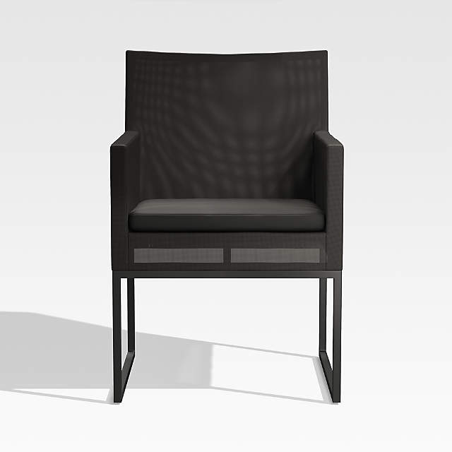 https://cb.scene7.com/is/image/Crate/DuneBlkODDngArmChrSOSSS23_3D/$web_pdp_main_carousel_zoom_low$/221208114353/dune-black-outdoor-dining-arm-chair.jpg