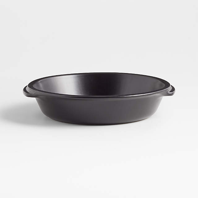 https://cb.scene7.com/is/image/Crate/EmileHenryCBPieDishMBkSSS23/$web_pdp_main_carousel_zoom_low$/221012152324/emile-henry-x-crate-and-barrel-black-ceramic-pie-dish.jpg