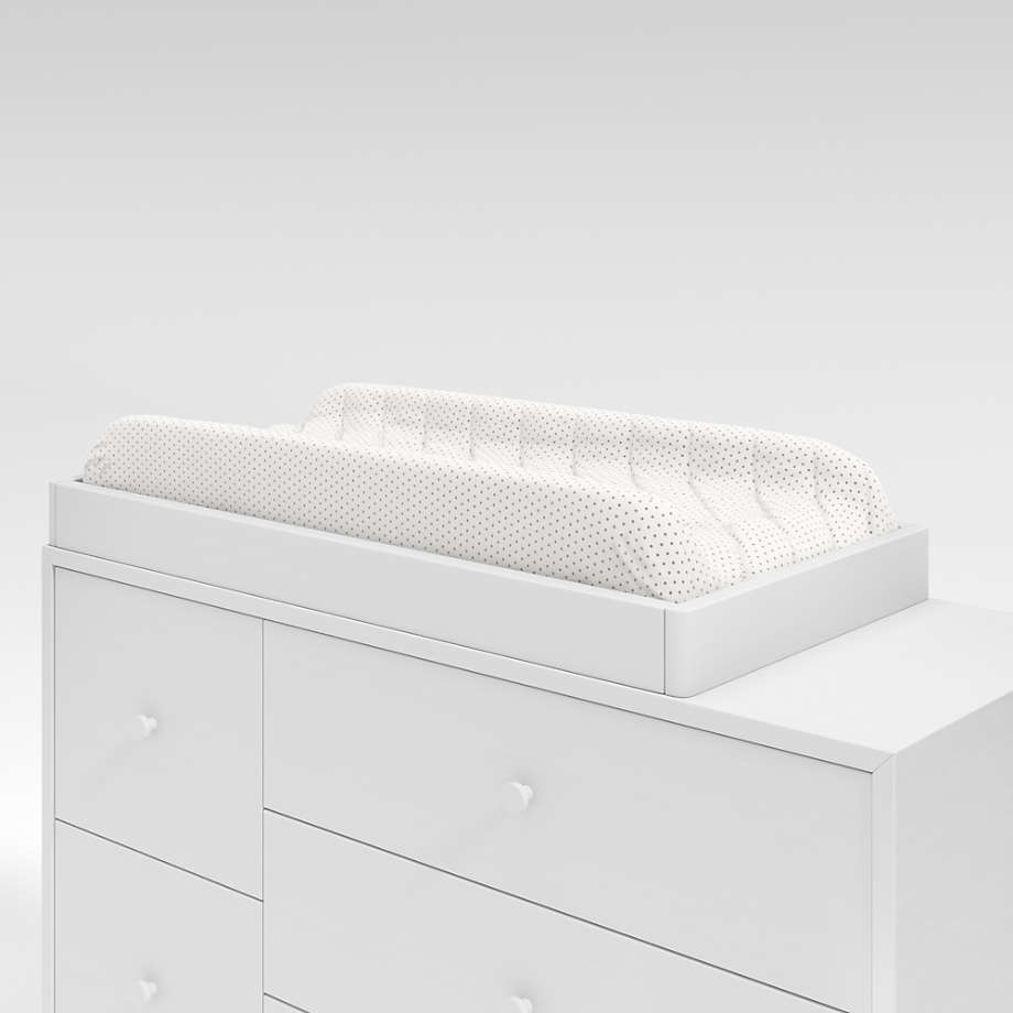 White dresser with outlet changing table topper