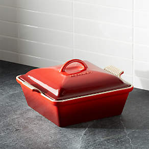 https://cb.scene7.com/is/image/Crate/LeCreuCovrdSquBkrCherrySHF16/$web_pdp_carousel_low$/220913133310/le-creuset-heritage-covered-square-cherry-red-baking-dish.jpg
