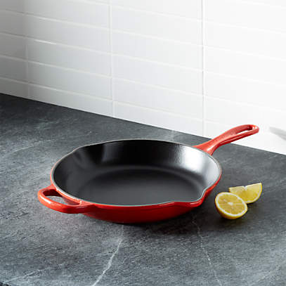 https://cb.scene7.com/is/image/Crate/LeCreuSig10inSkilletChrrySHF16/$web_pdp_main_carousel_low$/220913133313/le-creuset-signature-10-cherry-red-skillet.jpg