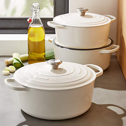 https://cb.scene7.com/is/image/Crate/LeCreuSigRndFchOvWhiteGrpFHS17/$web_pdp_main_carousel_low$/220913133955/le-creuset-signature-round-white-french-ovens.jpg