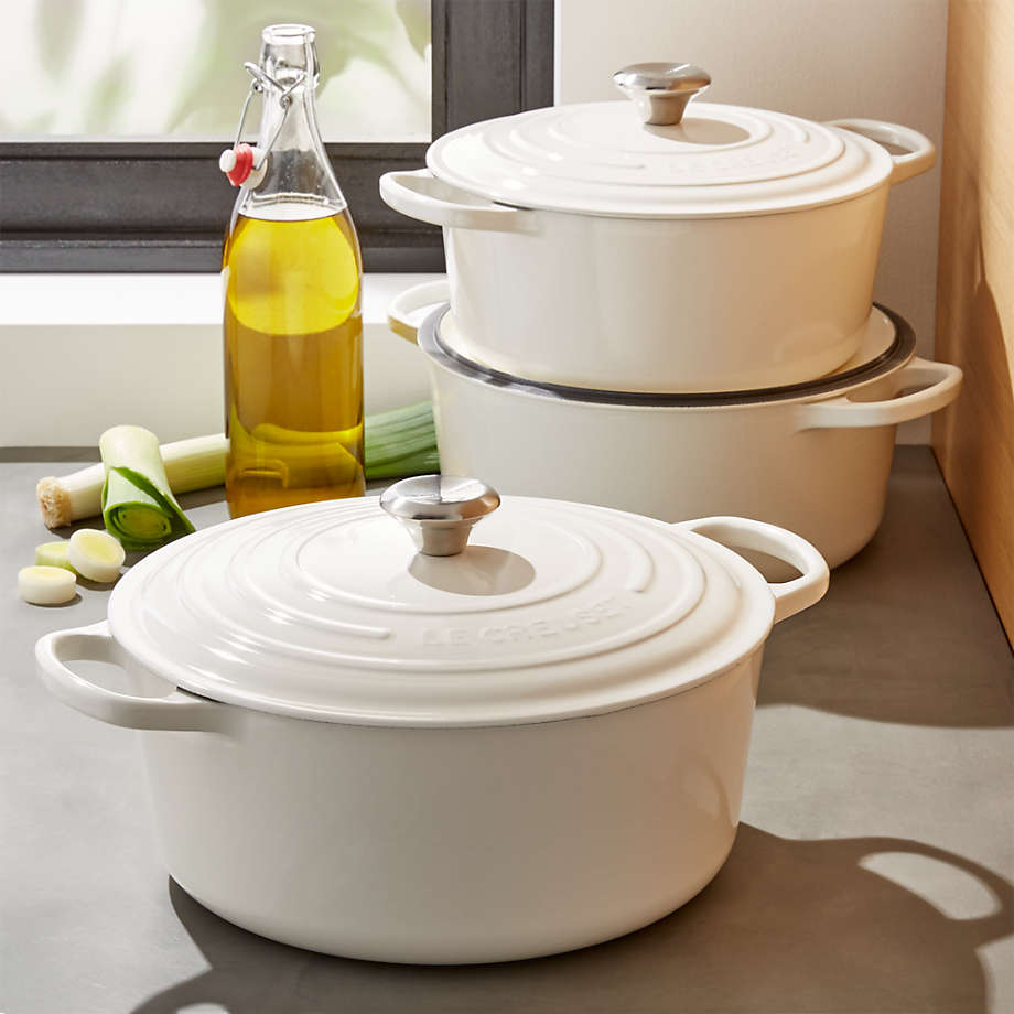 https://cb.scene7.com/is/image/Crate/LeCreuSigRndFchOvWhiteGrpFHS17/$web_pdp_main_carousel_med$/220913133955/le-creuset-signature-round-white-french-ovens.jpg