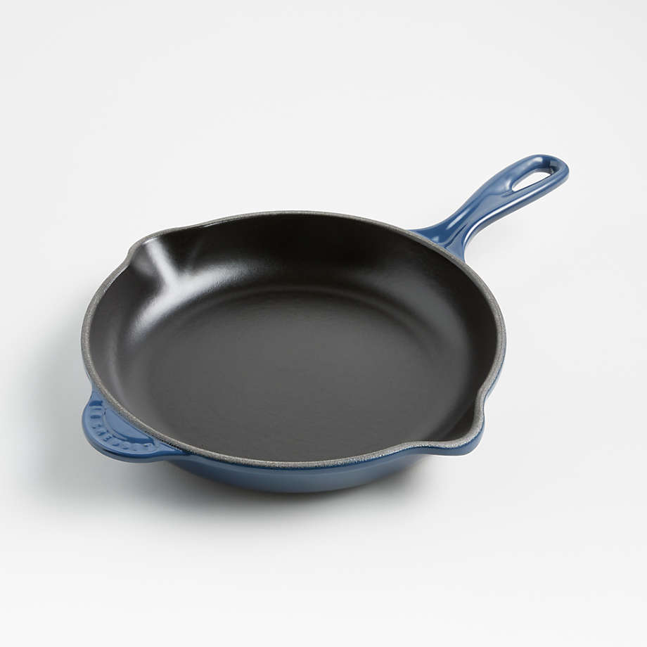 https://cb.scene7.com/is/image/Crate/LeCreusetClsc9inSkilletInkSSF22/$web_pdp_main_carousel_med$/220712162339/le-creuset-classic-9-ink-blue-enameled-cast-iron-skillet.jpg