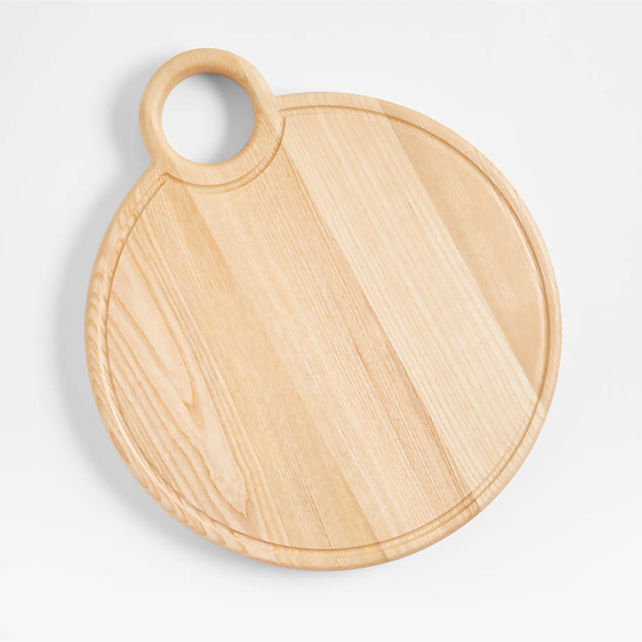 https://cb.scene7.com/is/image/Crate/MBTheChickenBoardSSS23/$web_pdp_main_carousel_med$/230217170312/round-wood-cutting-board-by-molly-baz.jpg