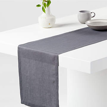 https://cb.scene7.com/is/image/Crate/MarinTblRunner90GphLnSSF21/$web_recently_viewed_item_sm$/210712141534/marin-graphite-grey-linen-90-table-runner.jpg