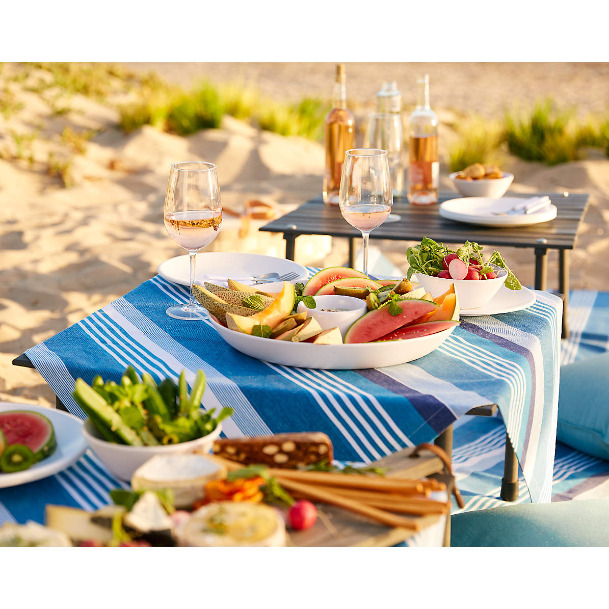 pair of different glass sizes and wines, red and white wine glasses on  wooden furniture table close up selective focus, vineyard farmhouse patio  view Photos