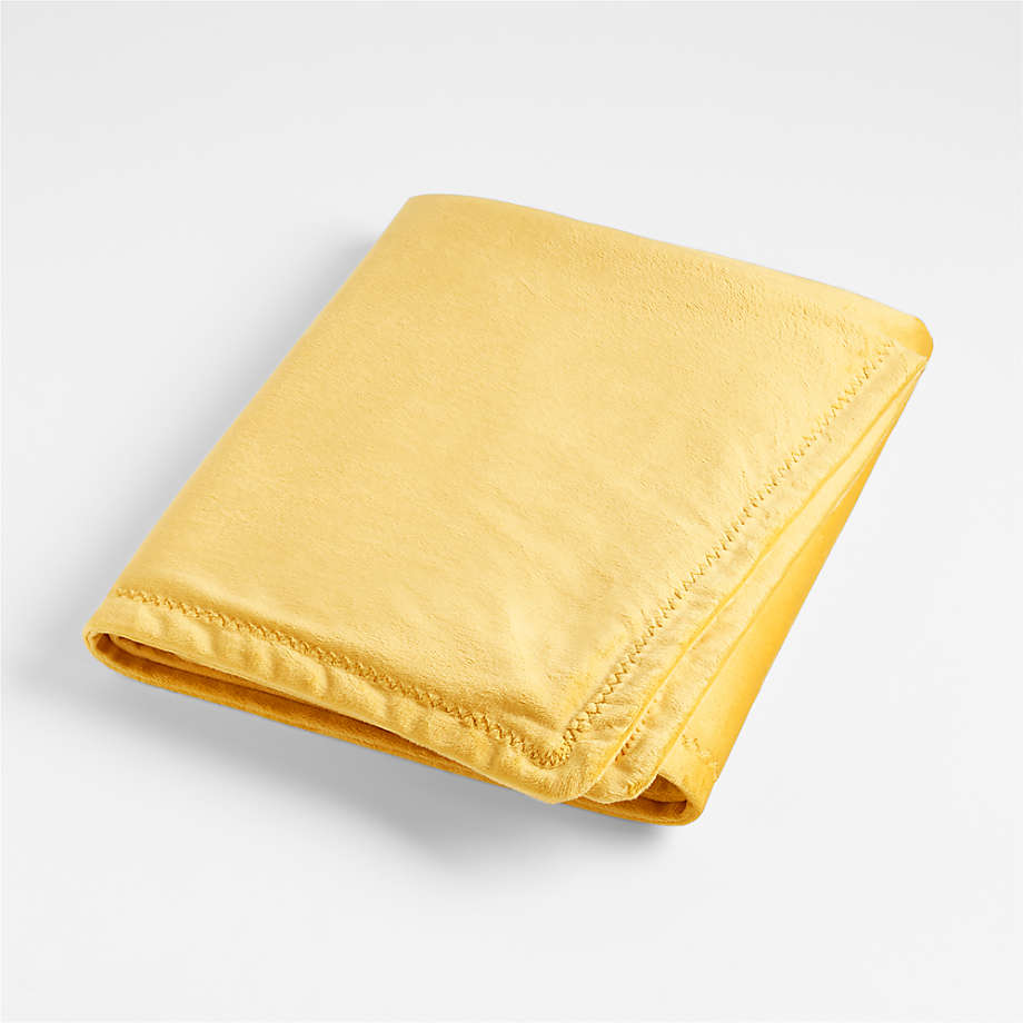 https://cb.scene7.com/is/image/Crate/MicrominkYLStrlBlnkSSS22/$web_pdp_main_carousel_med$/220210131511/yellow-micromink-stroller-blanket.jpg