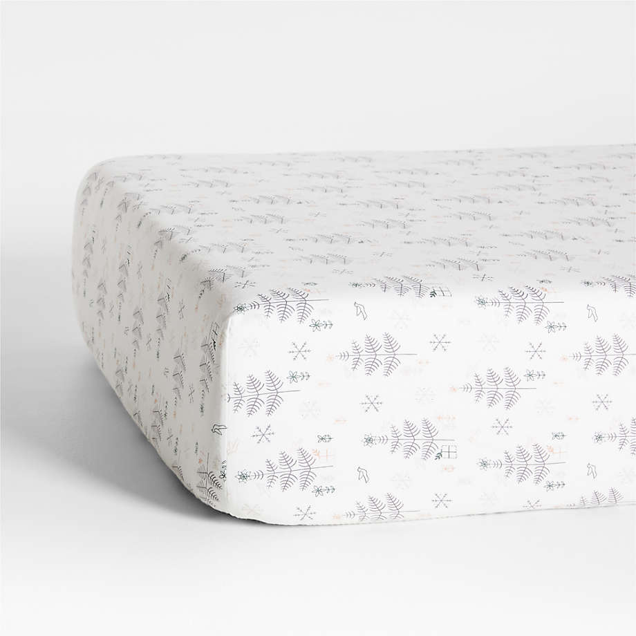 https://cb.scene7.com/is/image/Crate/NordicWinterOrgFlnCrbFtShSSF23/$web_pdp_main_carousel_med$/230816113049/supercozy-nordic-winter-organic-cotton-flannel-baby-crib-fitted-sheet.jpg