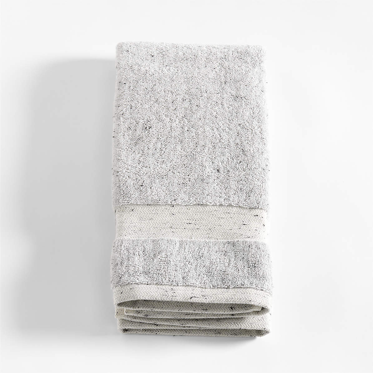 https://cb.scene7.com/is/image/Crate/OrgTurkishGFHandTowelSSF23/$web_pdp_main_carousel_zoom_med$/230501152014/organic-turkish-cotton-grey-fleck-hand-towel.jpg