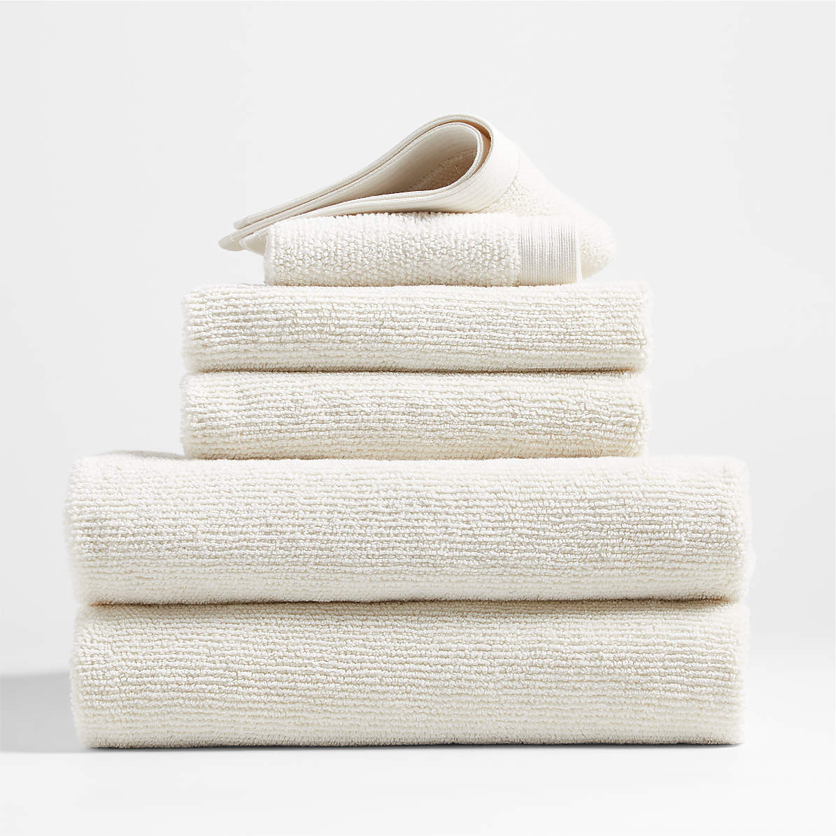https://cb.scene7.com/is/image/Crate/OrganicAntiMicTowelsWIvrS6SSF22/$web_pdp_main_carousel_zoom_med$/220802125803/antimicrobial-organic-cotton-woolen-ivory-bath-towels-set-of-6.jpg