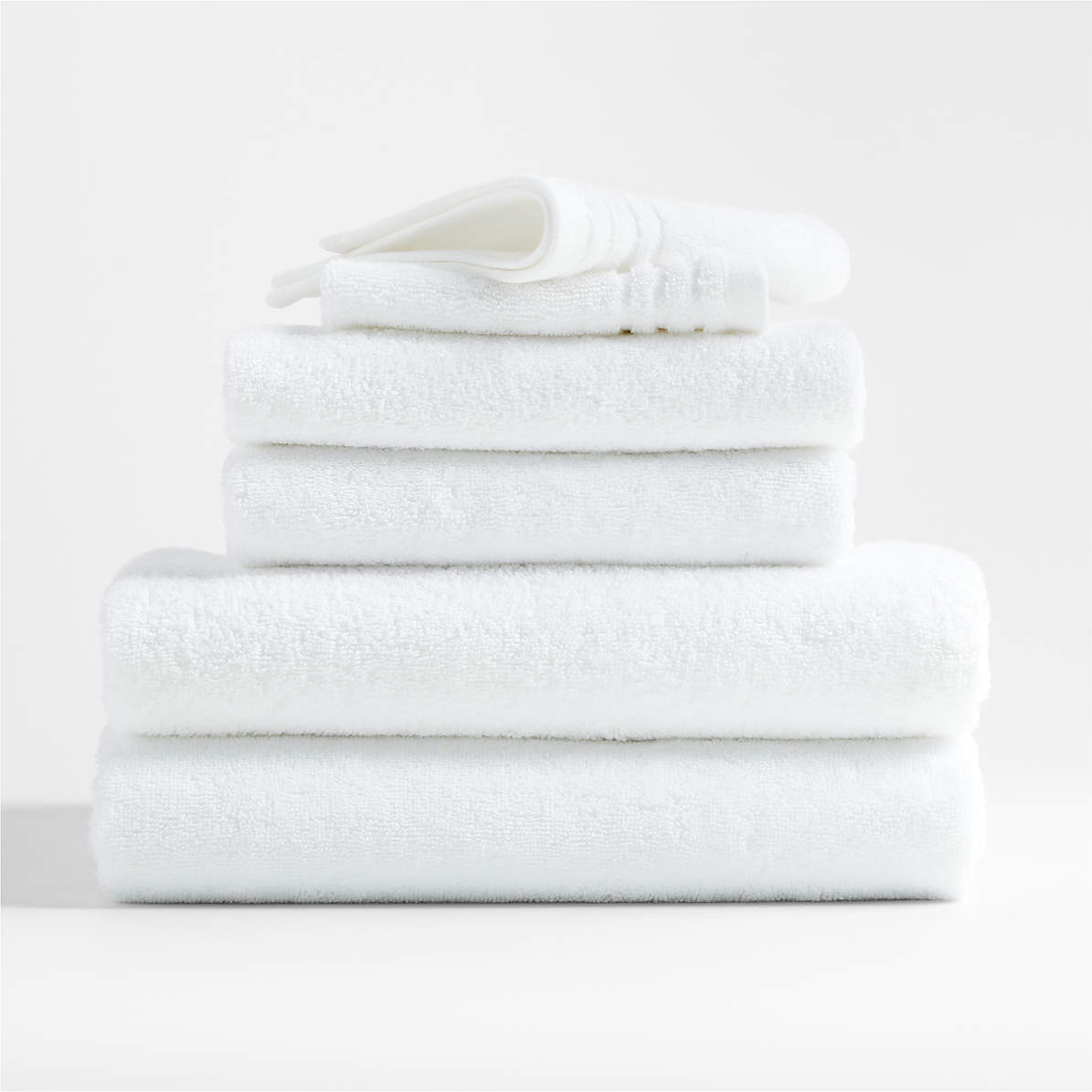 https://cb.scene7.com/is/image/Crate/OrganicCtnRfbTowelsCrWhS6SSF22/$web_pdp_main_carousel_zoom_med$/220712150026/refibra-organic-cotton-crisp-white-bath-towels-set-of-6.jpg