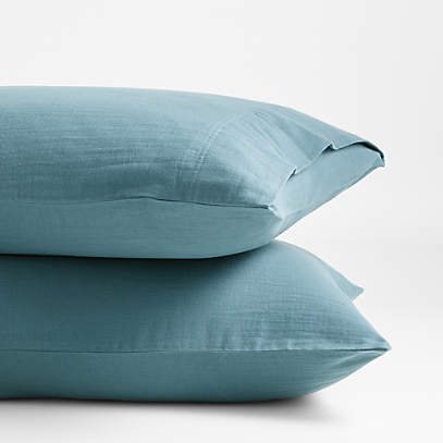 https://cb.scene7.com/is/image/Crate/OrganicDblWvStdCsPrTealSSS22/$web_pdp_main_carousel_low$/220224101656/organic-double-weave-cotton-f-q-sheet-set-teal.jpg