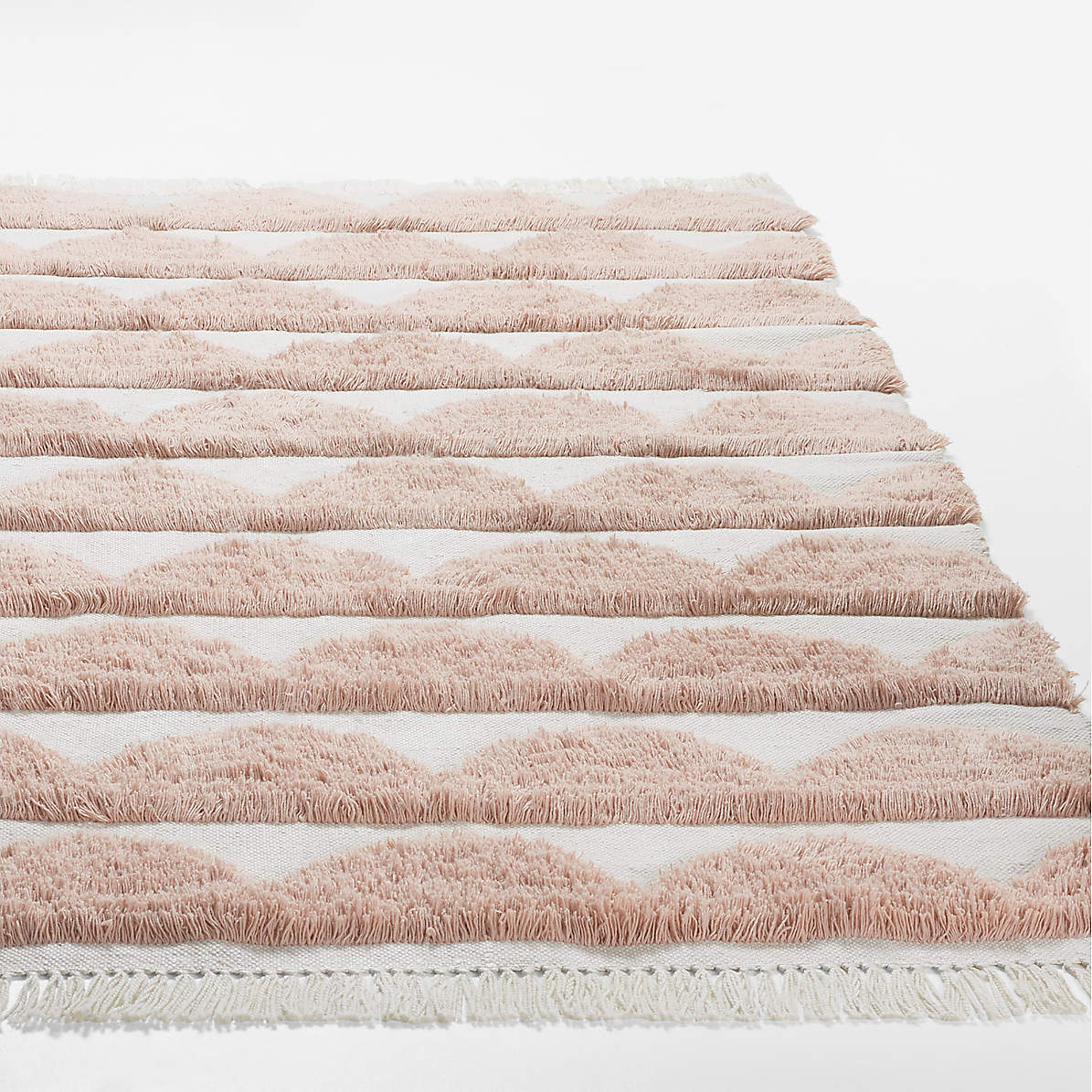 https://cb.scene7.com/is/image/Crate/OuluScallopPET5x8RugSSF22/$web_pdp_main_carousel_zoom_med$/220601113049/oulu-handwoven-pink-and-white-scallop-textured-rug.jpg