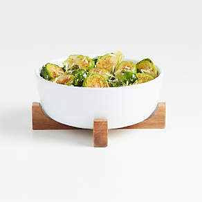 https://cb.scene7.com/is/image/Crate/OvenToTableBowlWTrivetSSS21/$web_pdp_carousel_low$/210415155420/oven-to-table-bowl-with-trivet.jpg