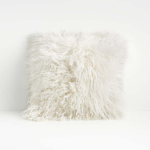 white fluffy throw pillows