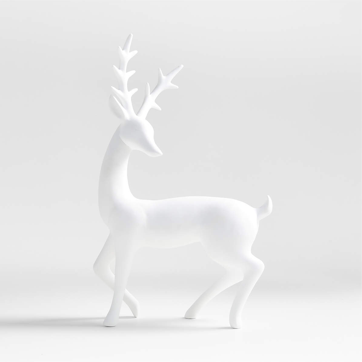 https://cb.scene7.com/is/image/Crate/PorcelainReindeerSSF23/$web_pdp_main_carousel_zoom_med$/230606152914/white-porcelain-holiday-reindeer-sculpture.jpg