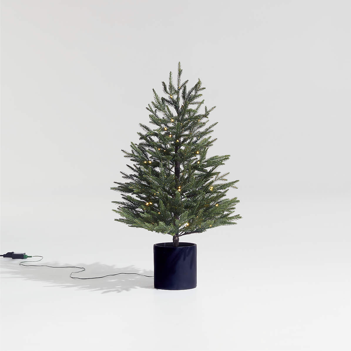 https://cb.scene7.com/is/image/Crate/PreLitNorwaySpruceTree3ftROF21/$web_pdp_main_carousel_zoom_med$/210817094843/faux-potted-norway-spruce-pre-lit-led-tree-with-white-lights-3.jpg