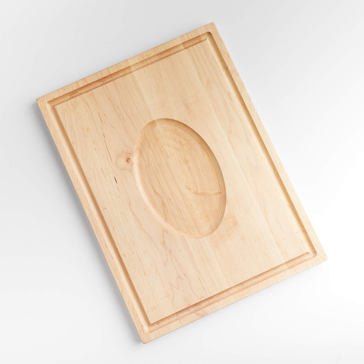 https://cb.scene7.com/is/image/Crate/RevMapleCutBdWMtRst24x18SSF22/$web_pdp_main_carousel_zoom_med$/220512162529/reversible-maple-cutting-board-with-meat-rest-24-x-18.jpg