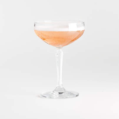 Two tall cocktail glasses with pink gin and tonic garnished with large  crystals of salt on an edge of a glass, large piece of ice, peppermint  Stock Photo - Alamy