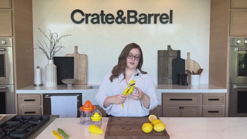 Play Crate & Barrel Citrus Squeezer with Measuring Cup - video 1 of 1