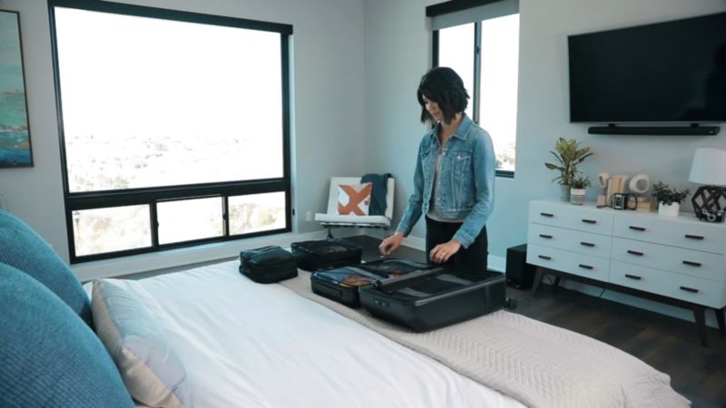 Play NOMATIC Black Check-In Suitcase - video 1 of 1