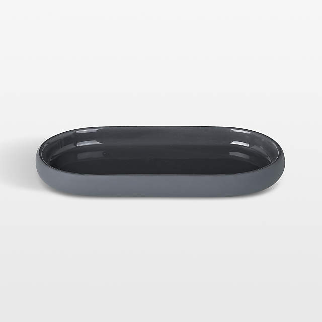 https://cb.scene7.com/is/image/Crate/SONOOvalTrayChrSSF23_VND/$web_pdp_main_carousel_zoom_low$/231031183341/blomus-sono-ceramic-magnet-grey-oval-bathroom-tray.jpg