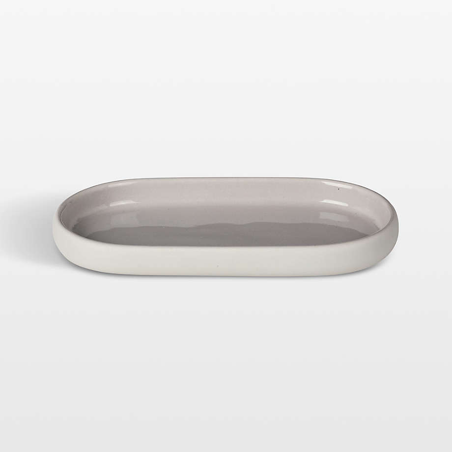 https://cb.scene7.com/is/image/Crate/SONOOvalTrayCrmSSF23_VND/$web_pdp_main_carousel_med$/231031183341/blomus-sono-ceramic-moonbeam-cream-oval-bathroom-tray.jpg