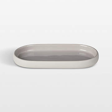 https://cb.scene7.com/is/image/Crate/SONOOvalTrayCrmSSF23_VND/$web_recently_viewed_item_sm$/231031183341/blomus-sono-ceramic-moonbeam-cream-oval-bathroom-tray.jpg